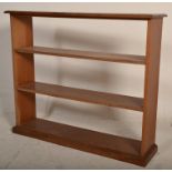 An Edwardian early 20th century solid mahogany open window library bookcase having three shelves