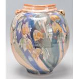 Stefanie Newton - A 20th Century studio art pottery vase of bulbous form having twin handles to