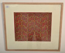 A 20th Century Panamanian mola cloth having a hand stitched applique stylised geometric design