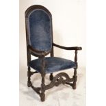A 17th century oak armchair. Raised on block and turned legs with arched crinoline stretcher to