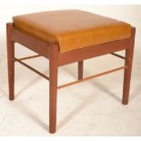 A mid century G-Plan teak wood upholstered foot stool ottoman. Raised on teak wood tapering legs