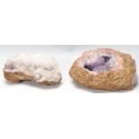 Two geological amethyst geode specimen rocks.