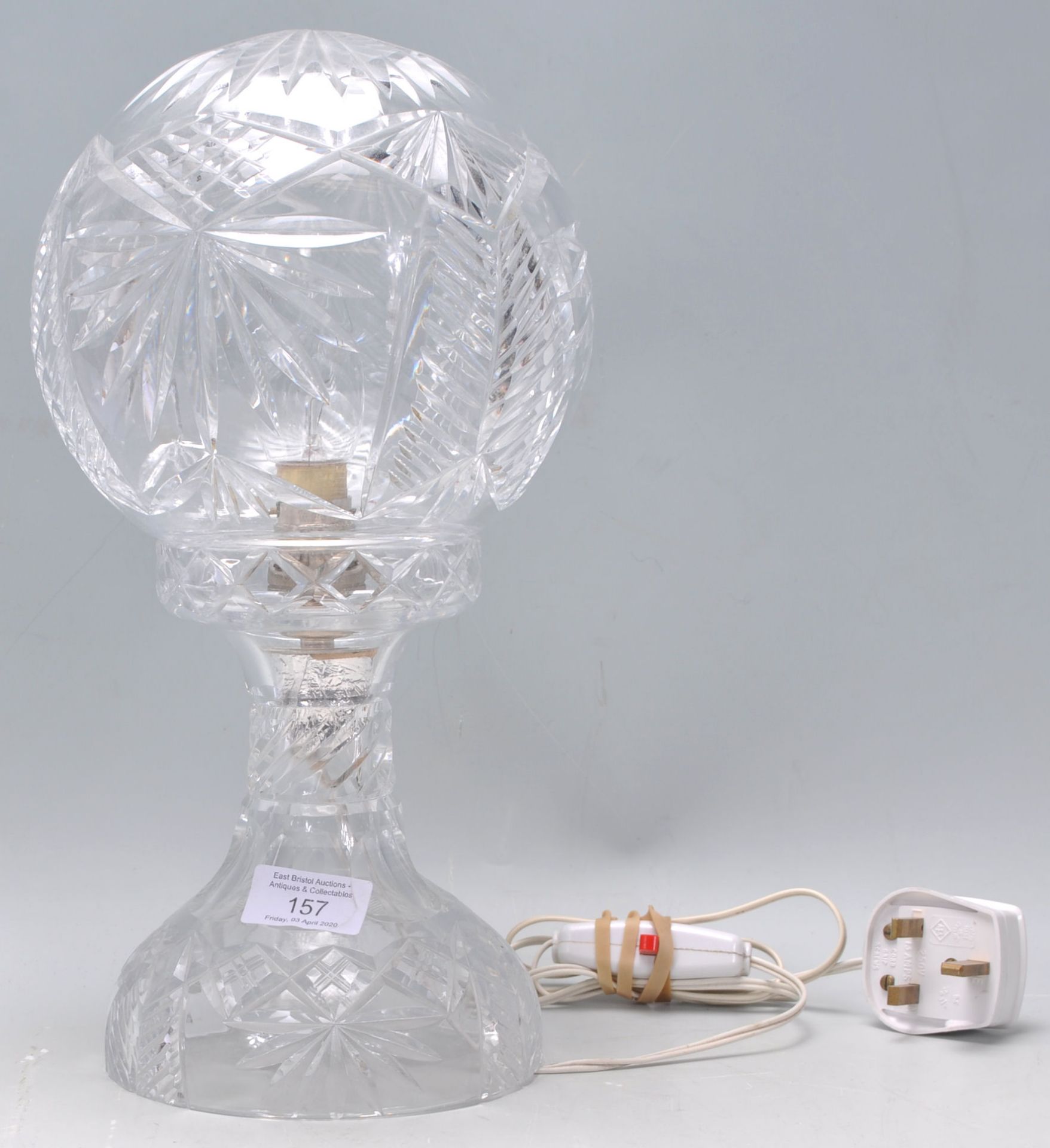 A lovely early 20th Century Edwardian cut glass table lamp having a cut glass round shade.