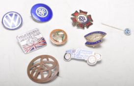 Motoring Related - A small group of vintage enamel pin badges to include 1888 - 1938 Dunlop button