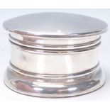 A large early 20th Century silver hallmarked powder pot / table compact of cylindrical form having a