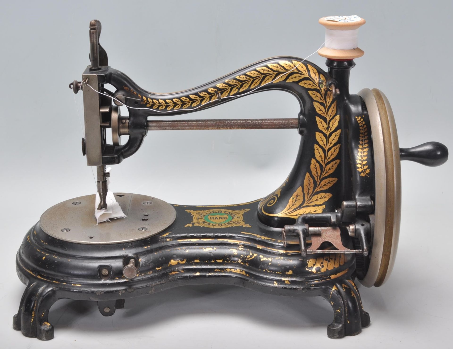 A vintage early 20th Century cast iron sewing machine by Jones 'The Lightning Hand Machine' having