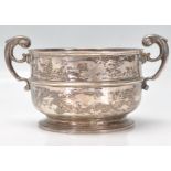 A late 19th Century Victorian silver hallmarked bowl having twin scroll handles. Hallmarked for