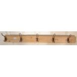 A set of early 20th Century vintage school / gymnasium hooks, five in total, each mounted on a