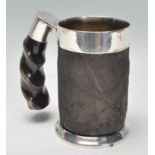 An unusual vintage 20th Century silver plate on copper tankard having elephant skin covered body and