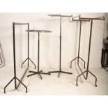 A group of three 20th Century haberdashery shop clothes rails of tubular construction of varying