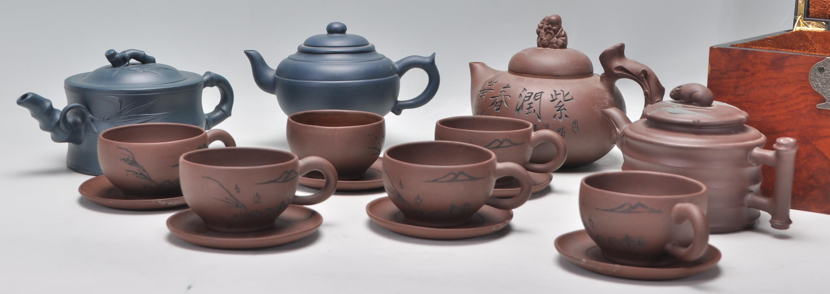 A Chinese Yixing clay teapot having carved decoration of a seated male figure with character marks - Image 11 of 13