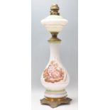 A 19th Century Victorian milk glass and brass oil lamp having a transfer printed classical