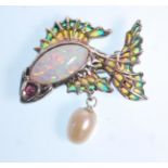 A stamped 925 silver brooch in the form of a fish having plique a jour panels and set with an opal
