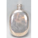 A good large vintage 20th Century silver hallmarked hip flask of simple form having a screw cover.