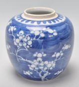 A late 19th / early 20th Century Chinese ginger jar of bulbous form being hand painted in blue an