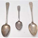 Two 19th Century Georgian silver hallmarked serving spoons. One having engraved scroll and floral