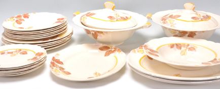 An early 20th Century vintage Royal Doulton part dinner service in the Ashley pattern decorated with