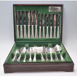 A 20th Century wooden cased Butler's cutlery canteen filled with silver plated cutlery, the interior