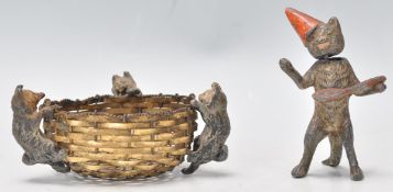 A charming late 19th Century small cast figure of three cats / kittens climbing into a metal woven