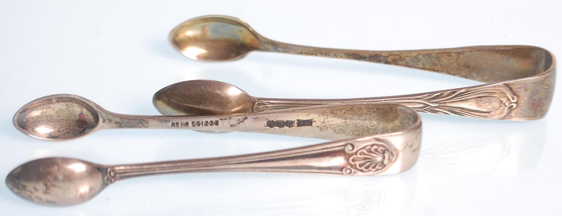 Two silver hallmarked sugar tongs dating from the early 20th Century to include a plane example - Image 4 of 6