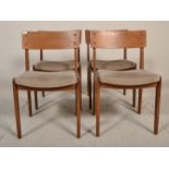 A good set of four vintage retro 20th Century teak framed dining chairs having single bentwood