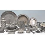 A collection of 18th Century antique pewter wares to include a large selection of plates and