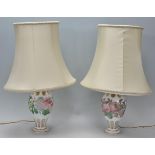 A pair of 20th Century glass table lamps of bulbous tapering form, having faceted decoration to
