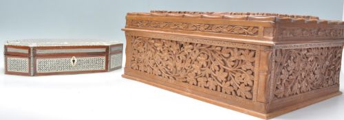 A good large vintage 20th Century camphor wood jewellery box with heavily carved foliate decoration.