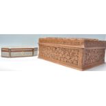 A good large vintage 20th Century camphor wood jewellery box with heavily carved foliate decoration.