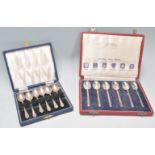 Two cased sets of silver hallmarked coffee spoons to include a set of six Mappin & Webb rat tail
