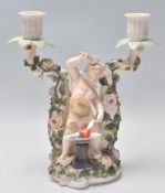 A 19th Century Victorian Dresden Sitzendorf porcelain table candelabra having twin sconces with