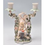 A 19th Century Victorian Dresden Sitzendorf porcelain table candelabra having twin sconces with