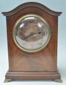 A good Edwardian mahogany 8 day mantel clock with silvered dial. Inset brass movement striking on