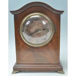 A good Edwardian mahogany 8 day mantel clock with silvered dial. Inset brass movement striking on