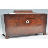 A 19th Century Victorian mahogany tea caddy of sarcophagus raised on bun feet with mother of pearl