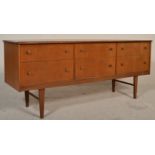 A retro mid century teak wood six drawer sideboard credenza of Danish influence. Raised on square