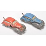 A pair of early 20th Century tinplate clockwork toy racing cars. One finished in red and the other