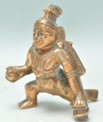 An early 20th Century Indian copper figure of Buddha shown in a standing position having engraved