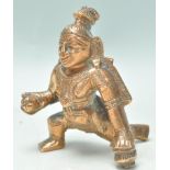 An early 20th Century Indian copper figure of Buddha shown in a standing position having engraved