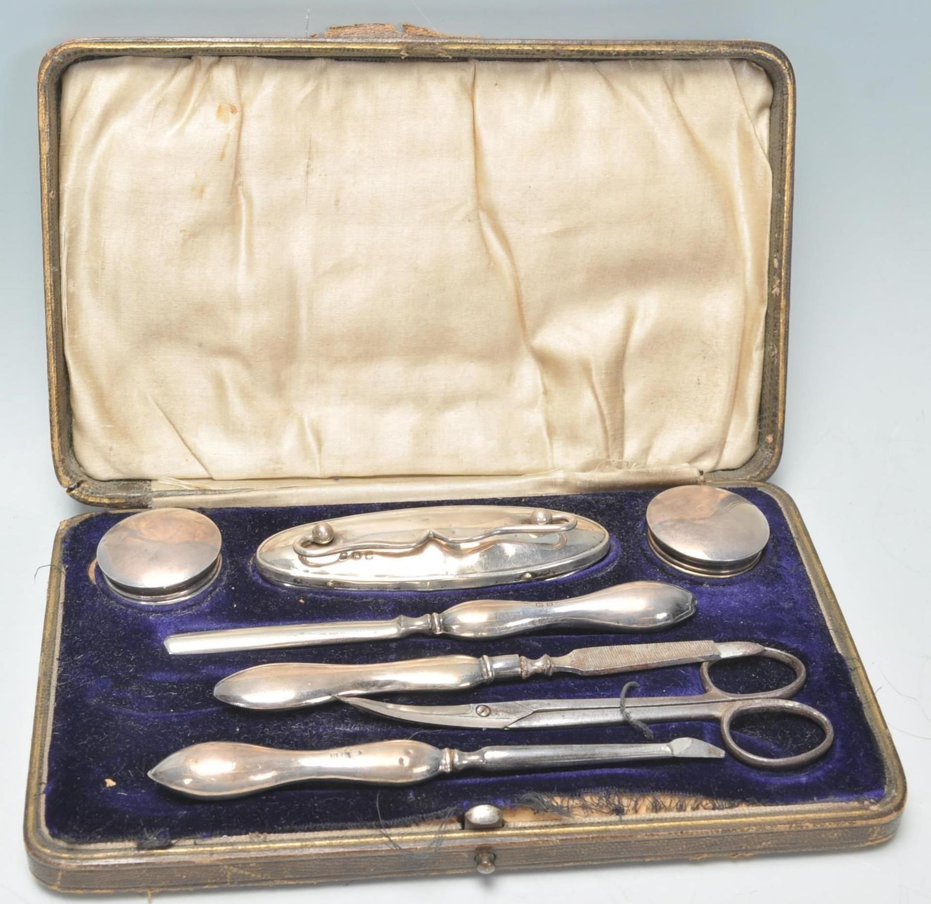 A good early 20th Century silver hallmarked ladies vanity set within original fitted leather case.