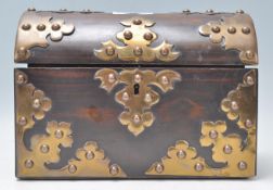 A Victorian 19th century coromandel dome top casket caddy with good armorial oversized brass strap