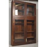 A Victorian 19th century mahogany haberdashery shop display cabinet in the campaign style. The large
