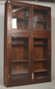 A Victorian 19th century mahogany haberdashery shop display cabinet in the campaign style. The large