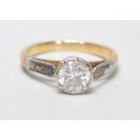 An 18ct gold and diamond single stone ring. The round cut diamond being approx ct weight 0.46cts