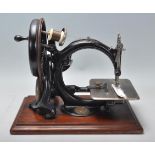 A good pine cased late 19th / early 20th Century Willcox & Gibbs sewing machine finished in black