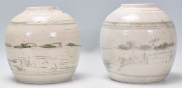 Two 17th 18th Century Chinese Ming dynasty ceramic ginger jars of bulbous form being hand painted