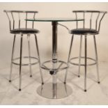 A 20th Century glass topped bistro style table having a black glass top raised on a chromed pedestal