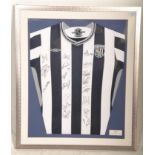 A framed and glazed West Bromwich Albion signed football shirt, The shirt with multiple autographs