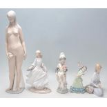 A collection of Lladro figurines to include a flamenco dancer girl, a Valencian girl with flowers