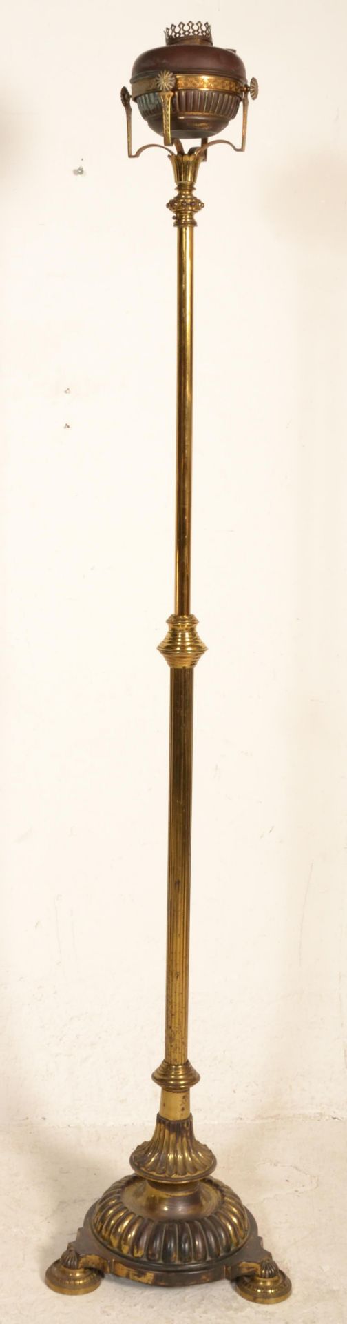 A 19th Century Victorian free standing oil lamp raised on a round base with three shell formed feet, - Image 4 of 4